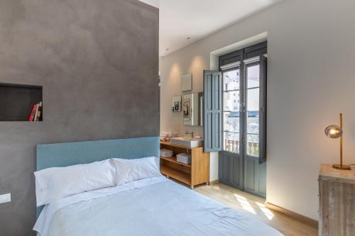 Posteľ alebo postele v izbe v ubytovaní Balmis Plaza Apartments