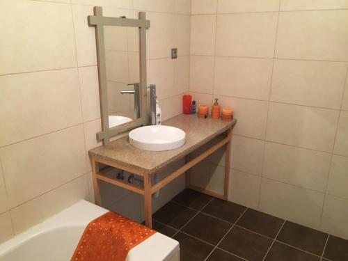 a bathroom with a sink and a mirror at Quinta da Marialva in Mangualde