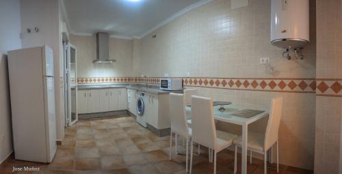 A kitchen or kitchenette at Santa Angela de la Cruz