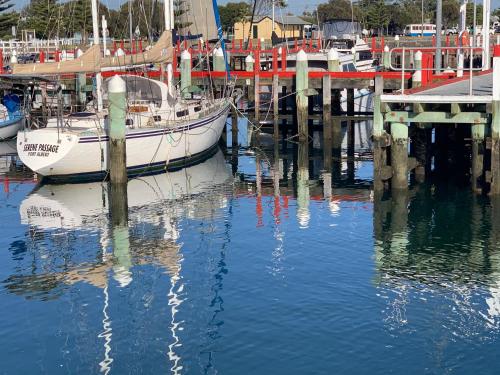 a group of boats are docked at a marina at Boat Harbour Jetty B&B in Port Albert