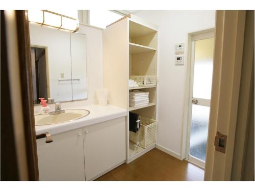 Una cocina o cocineta en iHouse あたみんち