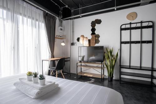 Postel nebo postele na pokoji v ubytování My Loft Hotel SHA