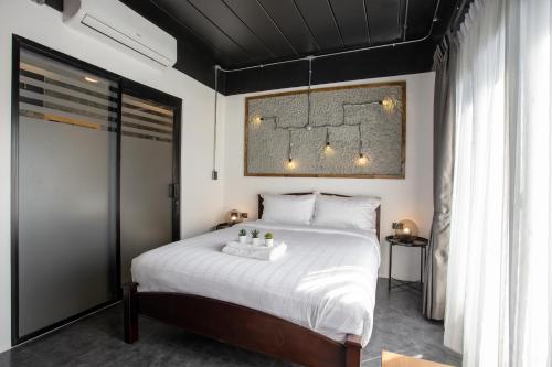 Postel nebo postele na pokoji v ubytování My Loft Hotel SHA