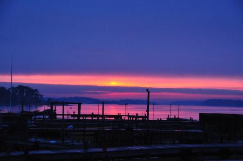 a sunset over a body of water with at Sands Hotell in Sandhamn