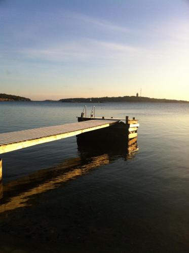 a dock on a body of water at Sands Hotell in Sandhamn