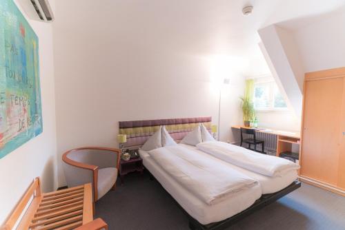 Postelja oz. postelje v sobi nastanitve Hotel Landgasthof Riehen / Basel