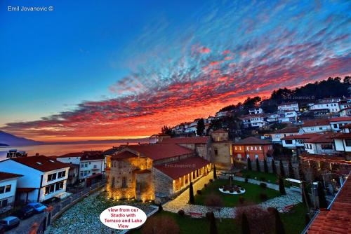 a view of a city at sunset at Jovanovic Guest House in Ohrid