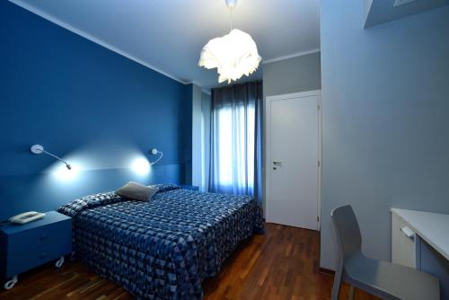 Una cama o camas en una habitación de Hotel Bristol