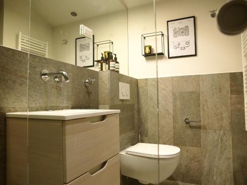 a bathroom with a toilet and a sink at Apartments House Filipović in Makarska