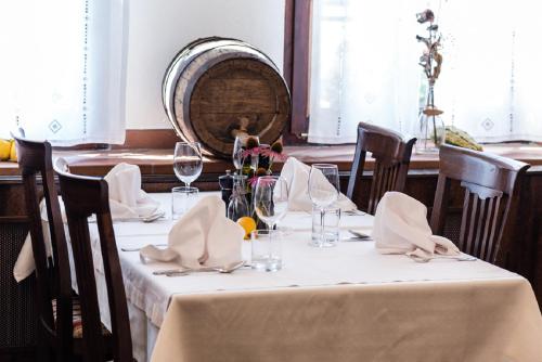 a table in a restaurant with a white table cloth at Guesthouse Bistra in Vrhnika
