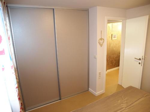 a large sliding closet door in a room at Apartments House Filipović in Makarska
