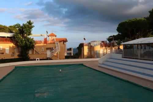a view of a swimming pool with a green pool at Guisomar in Palermo