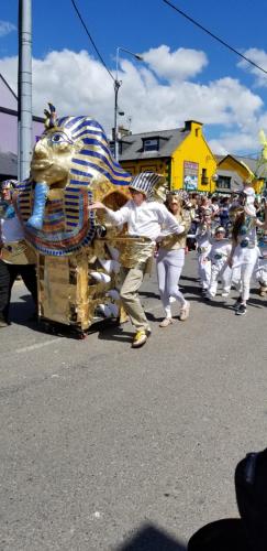 a group of people in a parade with aigator float at Baywatch Inn in Dingle