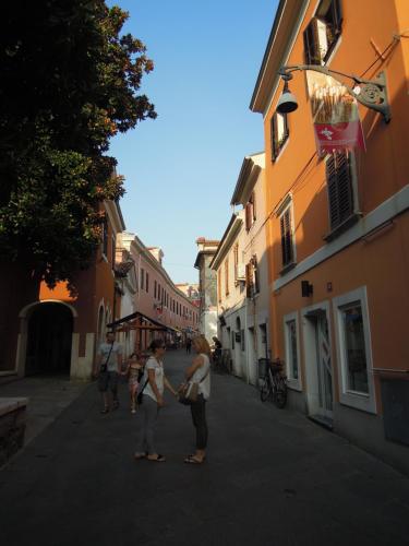a group of people walking down a street at Apartment Terassin in Koper