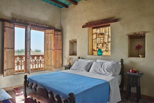 A bed or beds in a room at Talist Siwa