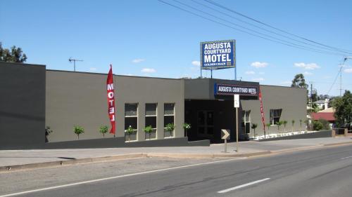 
a large building with a sign on the side of it at Augusta Courtyard Motel in Port Augusta
