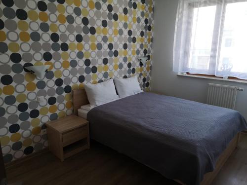 Ένα ή περισσότερα κρεβάτια σε δωμάτιο στο Apartament Marzenie 12 - Opole