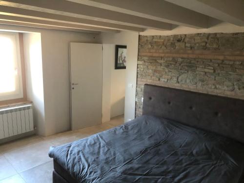 Ένα ή περισσότερα κρεβάτια σε δωμάτιο στο Borgo Stanzano