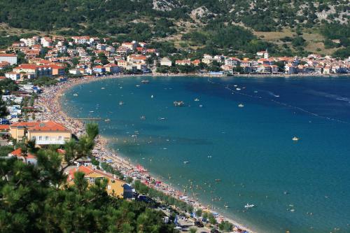 an aerial view of a beach with boats in the water at Studio Neva in Baška