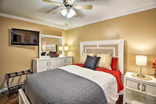 a bedroom with a bed with a ceiling fan and a tv at Sands Beach Club Condo with Ocean Views and Amenities! in Myrtle Beach