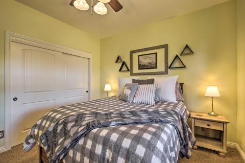 a bedroom with a bed and two lamps on a table at Sugar Bear Lodge with Game Room - 5 Mi to Village! in Lake Arrowhead