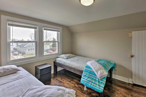 a bedroom with two beds and a window at The Cozzy House 4-Minute Drive to Miller Park! in West Allis
