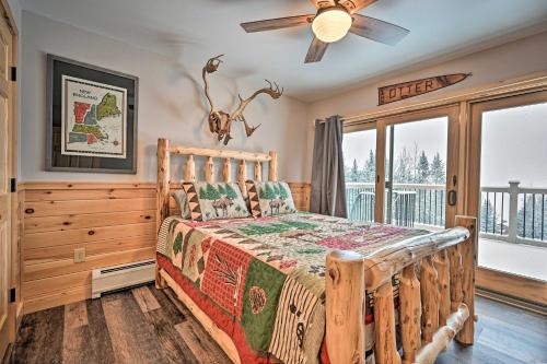 a bedroom with a wooden bed and a ceiling fan at Rustic 3-Story Pittsburg Cabin with Lake and Mtn Views in Pittsburg