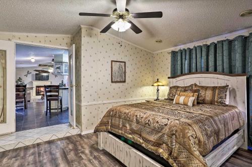 a bedroom with a bed and a ceiling fan at Broken Bow Home 2 Mi to Beavers Bend State Park in Broken Bow