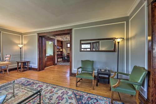 a living room with two green chairs and a mirror at Pet-Friendly Sheboygan Home, 1 Mi to Lake Michigan in Sheboygan