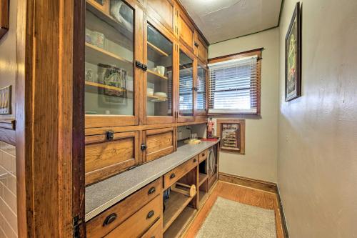 a kitchen with wooden cabinets and a counter top at Pet-Friendly Sheboygan Home, 1 Mi to Lake Michigan in Sheboygan