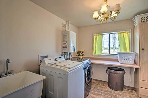 a laundry room with a washing machine and a window at The Eagar House White Mountains Gem with Views! in Springerville