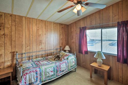 A bed or beds in a room at Bullhead City Home with Fire Pit - Walk to CO River!