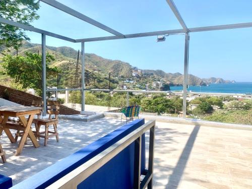 a patio with a view of the ocean from a house at Vito Hotel Boutique Taganga in Taganga