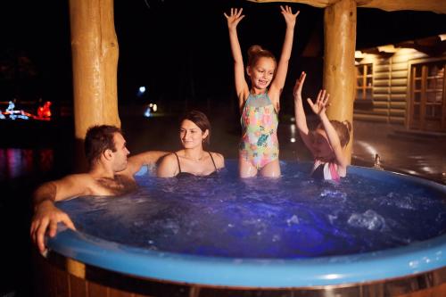 a group of people in a hot tub at Agroturystyka Olszynka in Skopanie