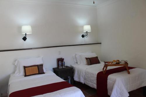 Cama o camas de una habitación en Hotel Antigua Posada