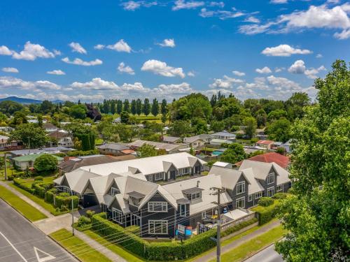 an aerial view of a large house in a residential neighborhood at Matamata Central Motel in Matamata