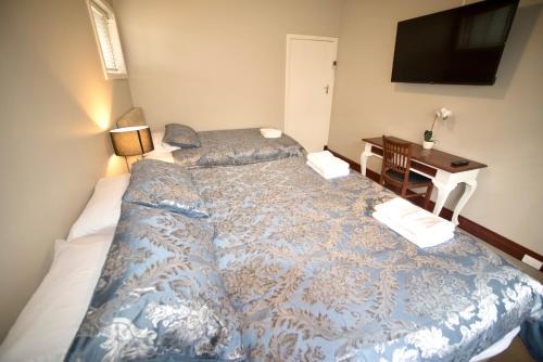 Una cama o camas en una habitación de Bõucher Manor - Northam