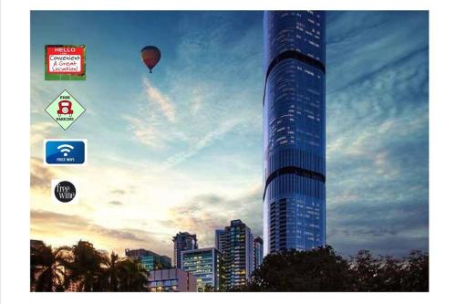 a tall building with a hot air balloon in the sky at Lvl 57 Skytower Breathtaking Views CBD Wifi Carpark by Stylish Stays in Brisbane