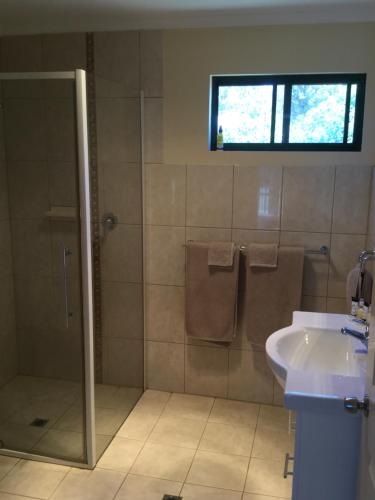 a bathroom with a shower and a sink at Breakaway Farmstay in Encounter Bay