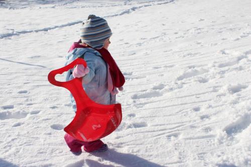 a young child walking in the snow at Apartments & Hostel Bohinj in Bohinj
