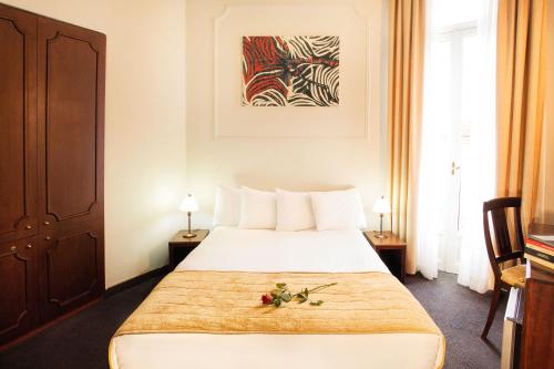 
Ένα ή περισσότερα κρεβάτια σε δωμάτιο στο Arni Hotel Domotel 
