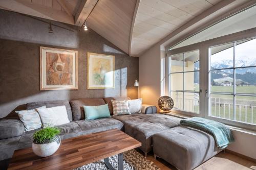 a living room with a couch and a table at Appartement Anna in Zell am Ziller