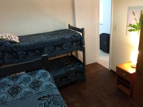 a bedroom with two bunk beds in a room at El chalecito de Marta (PH) in Necochea