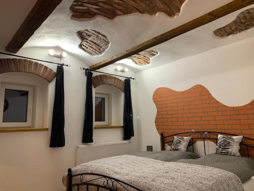 Postel nebo postele na pokoji v ubytování Apartmany Pod Kloboukem
