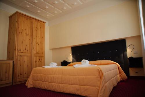 Postelja oz. postelje v sobi nastanitve Hotel Auronzo