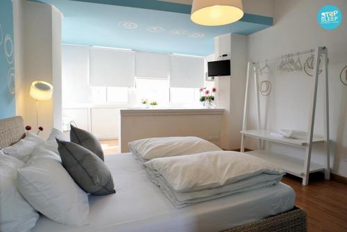 a bedroom with two beds and a television in it at Stop & Sleep Udine Fronte Ospedale Civile in Udine