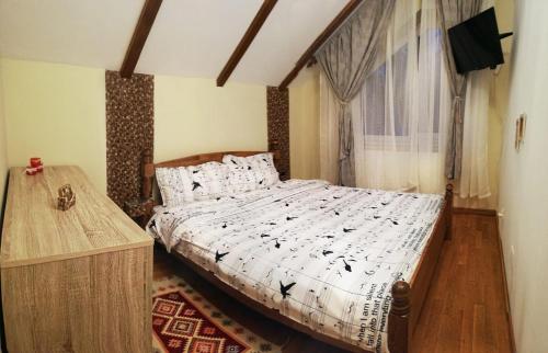 En eller flere senger på et rom på Vila Vladimir