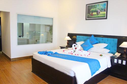 Ein Bett oder Betten in einem Zimmer der Unterkunft River Beach Resort & Residences