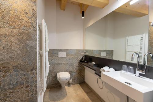 a bathroom with a sink and a toilet at Kappl Apart in Kappl