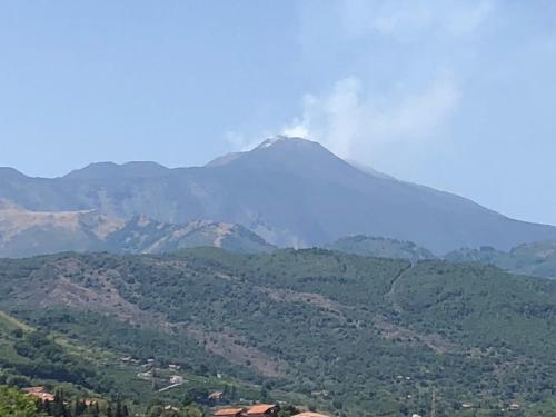 a view of a mountain with smoke coming out of it at Villa Carolea in Acireale